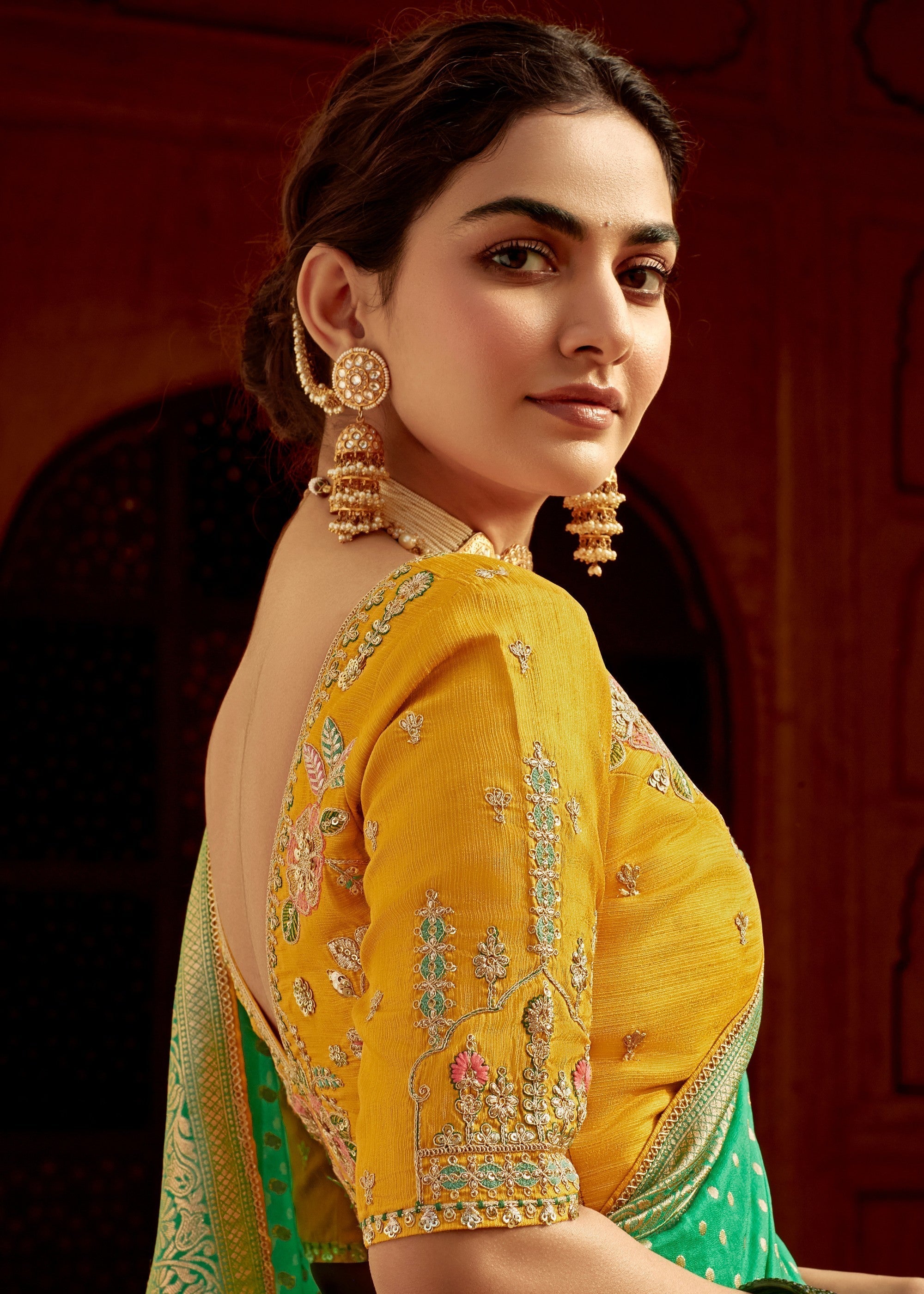 Emerald Green Dola Silk Saree Embellished With Weaving Work And Heavy Embroidered Blouse - qivii