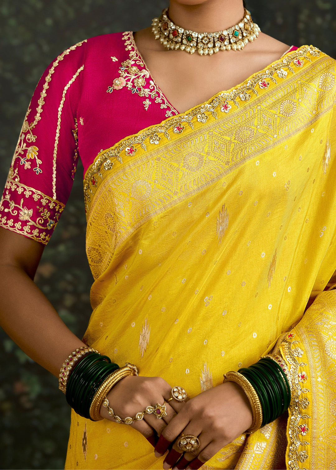 Beautiful yellow and magenta zari silk saree with intricate designs and traditional patterns