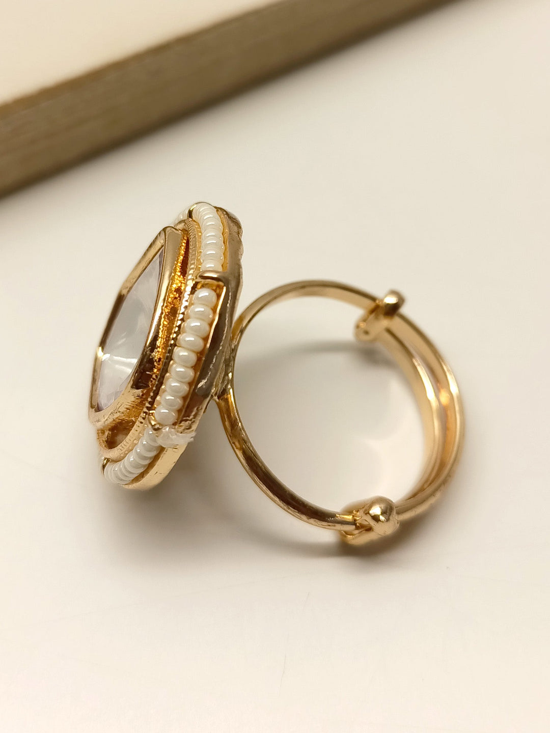  Side view of Yohanna White Kundan Finger Ring, showcasing its exquisite design and high-quality materials