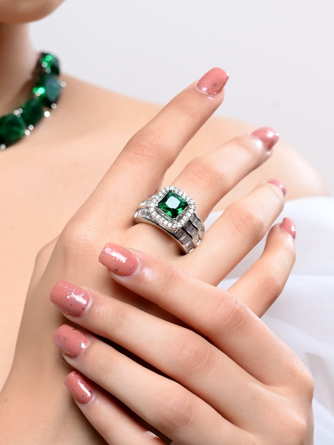 Close-up view of Zafeerah Green American Diamond Finger Ring with intricate design and sparkling stones