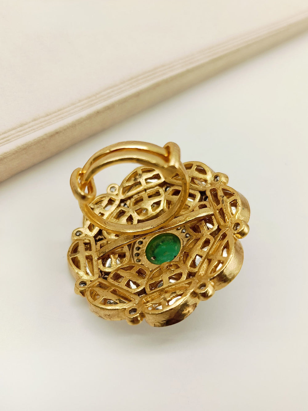  Exquisite Akuti emerald Kundan finger ring with traditional Indian design and radiant gemstones