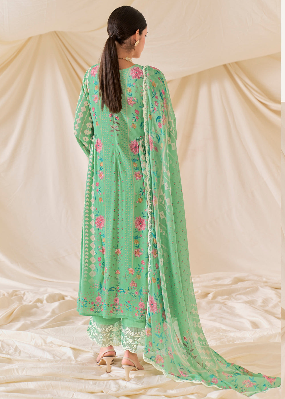 Elegant and stylish Green Pure Muslin Salwar Suit with Dori Embroidery