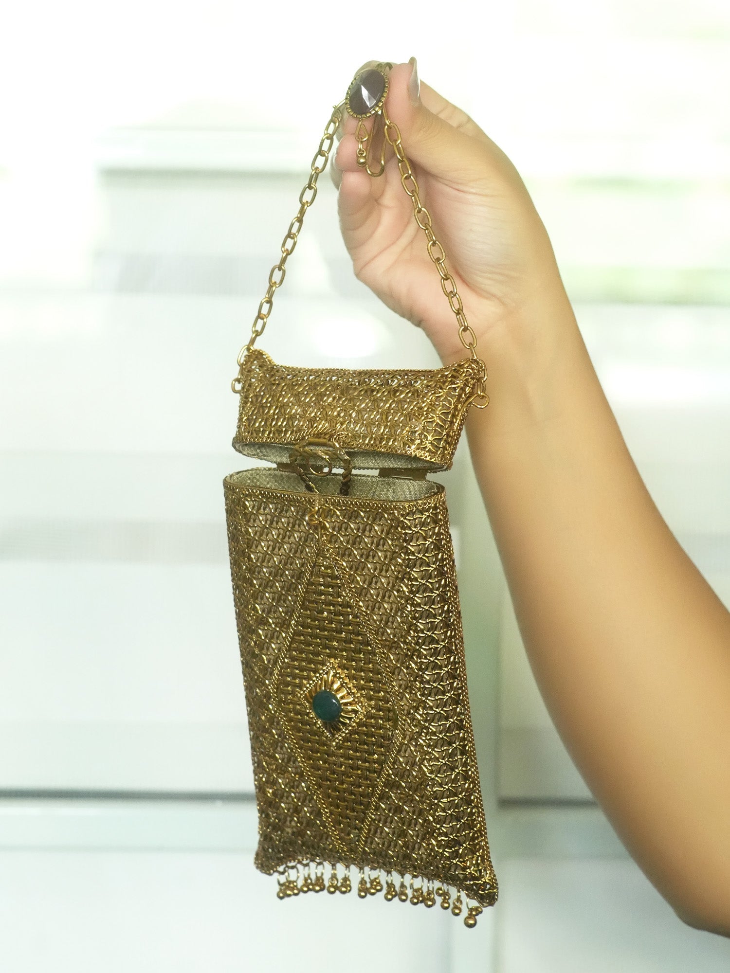 Saanvika Golden Mobile Pouch