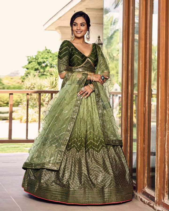 Green sequins thread embroidery work lehenga choli on mannequin