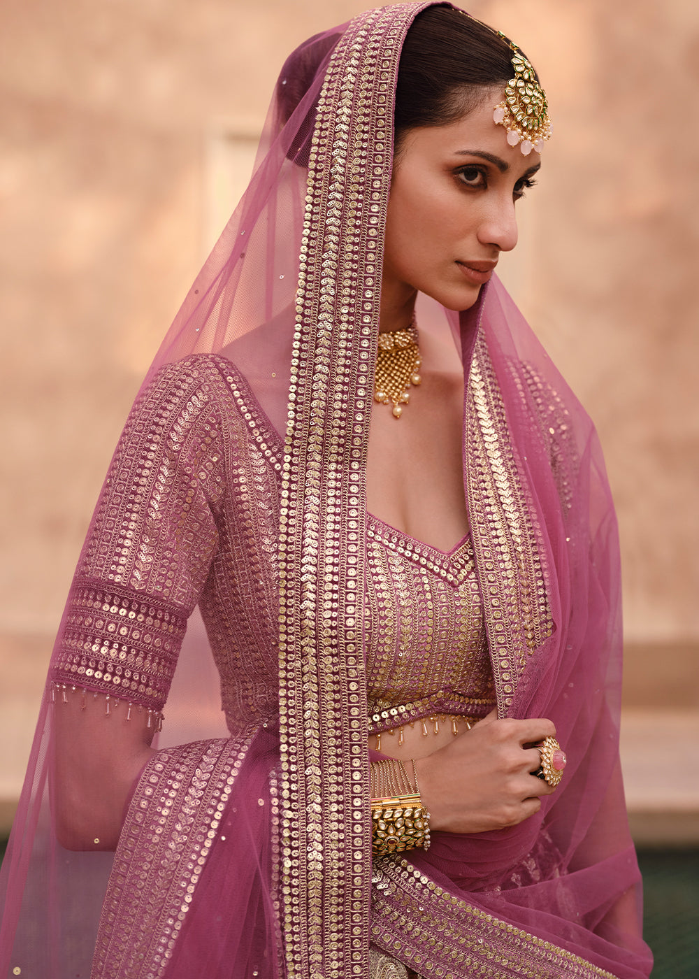 Detailed view of the delicate embroidery and intricate design on the pink Lehenga Choli