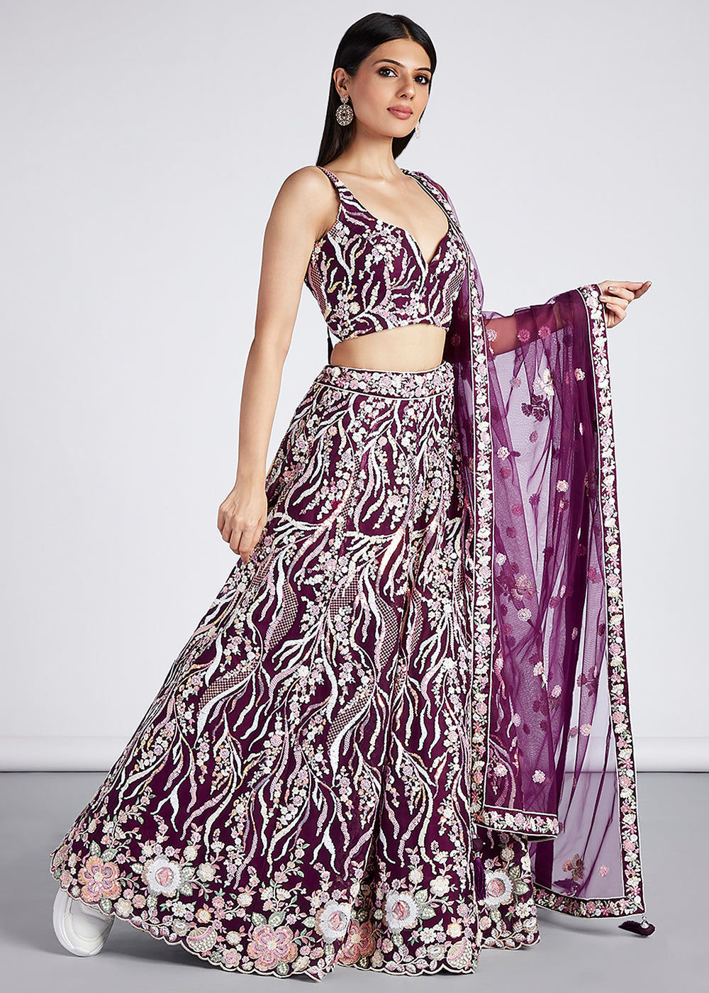 Close-up of the detailed sequin and thread embroidery work on the Tyrian Purple Net Lehenga Choli