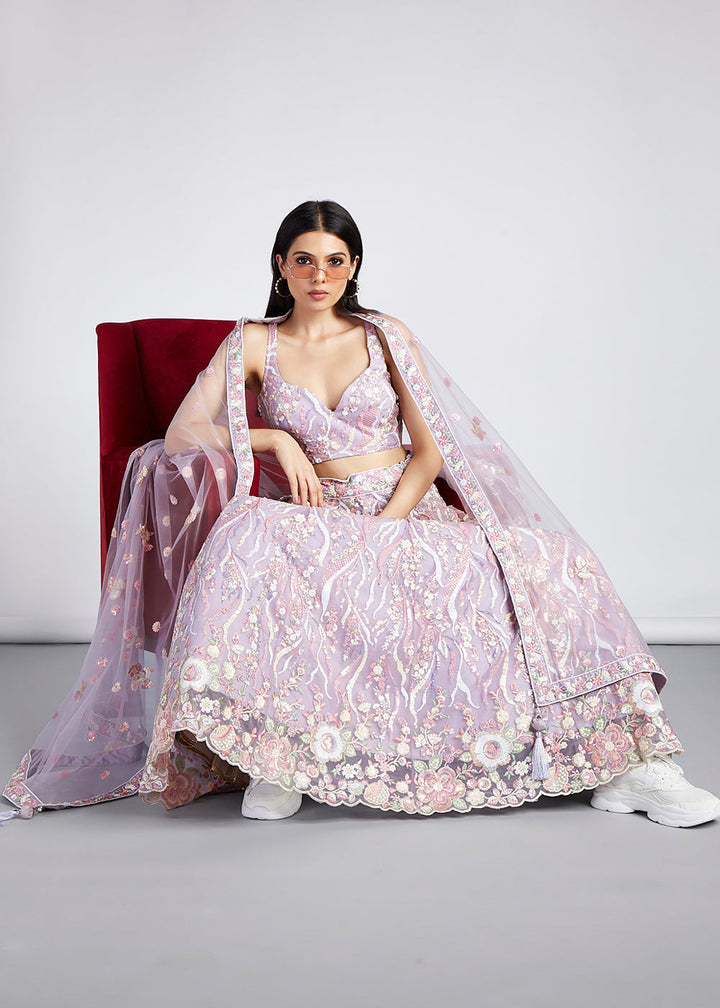 Exquisite thread embroidery work on a beautiful lilac purple lehenga choli