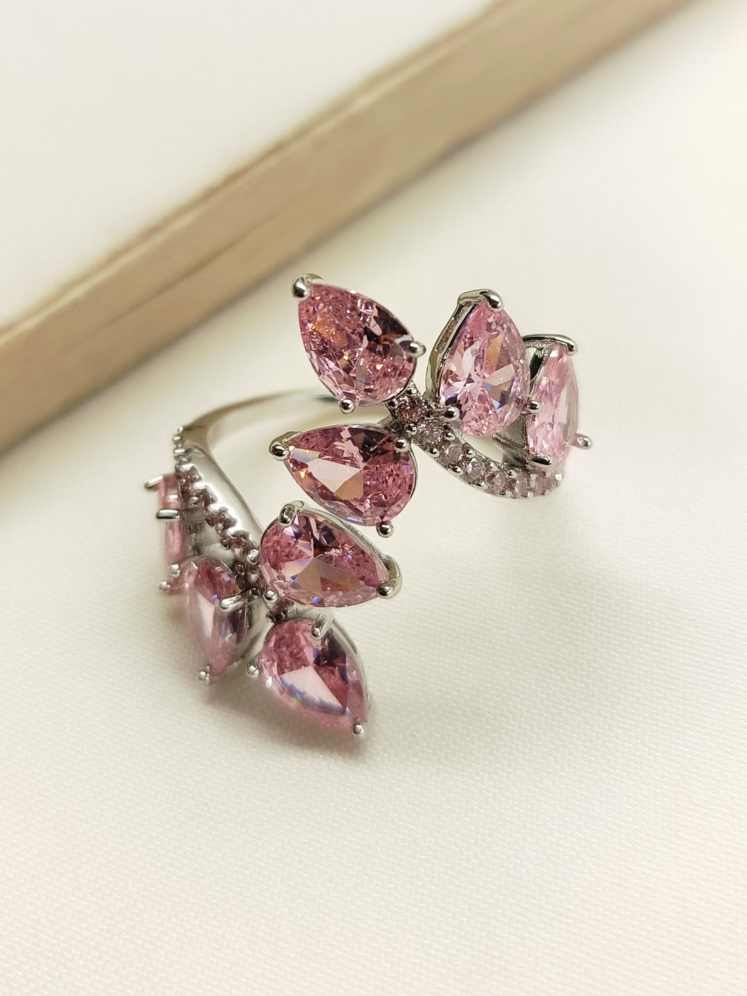 Latavya Pink American Diamond Finger Ring with Silver Band and Floral Design