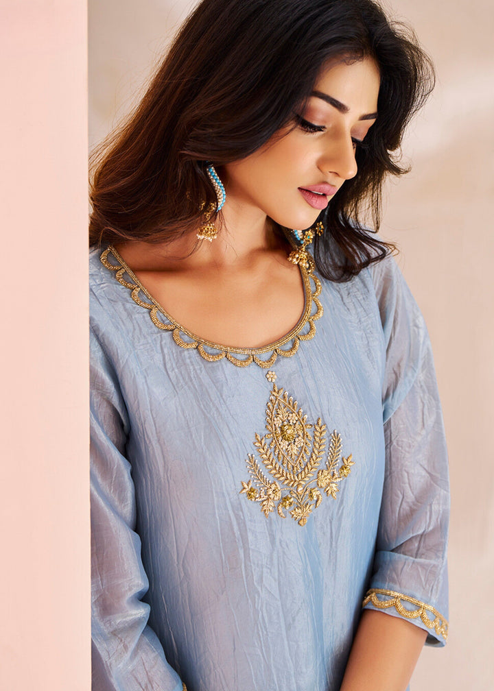 Beautiful pastel blue organza kurta with intricate handwork paired with matching pants