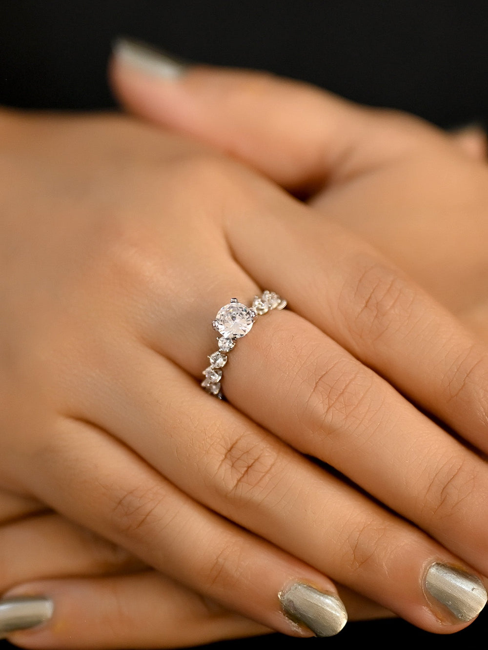 A close-up image of a stunning Heeba White American Diamond Finger Ring with intricate details and sparkling gemstones