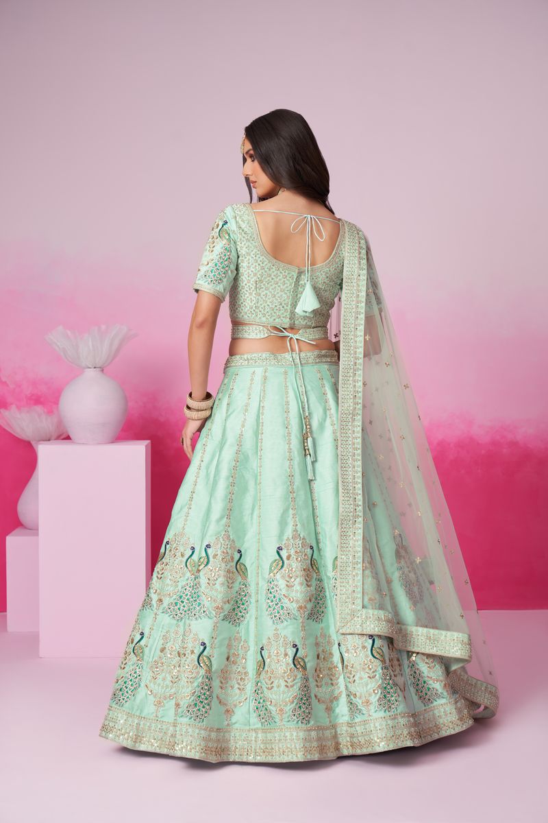 Seagreen bridal lehenga choli featuring pure silk, golden sequin, thread, moti, and zarkan heavy embroidery