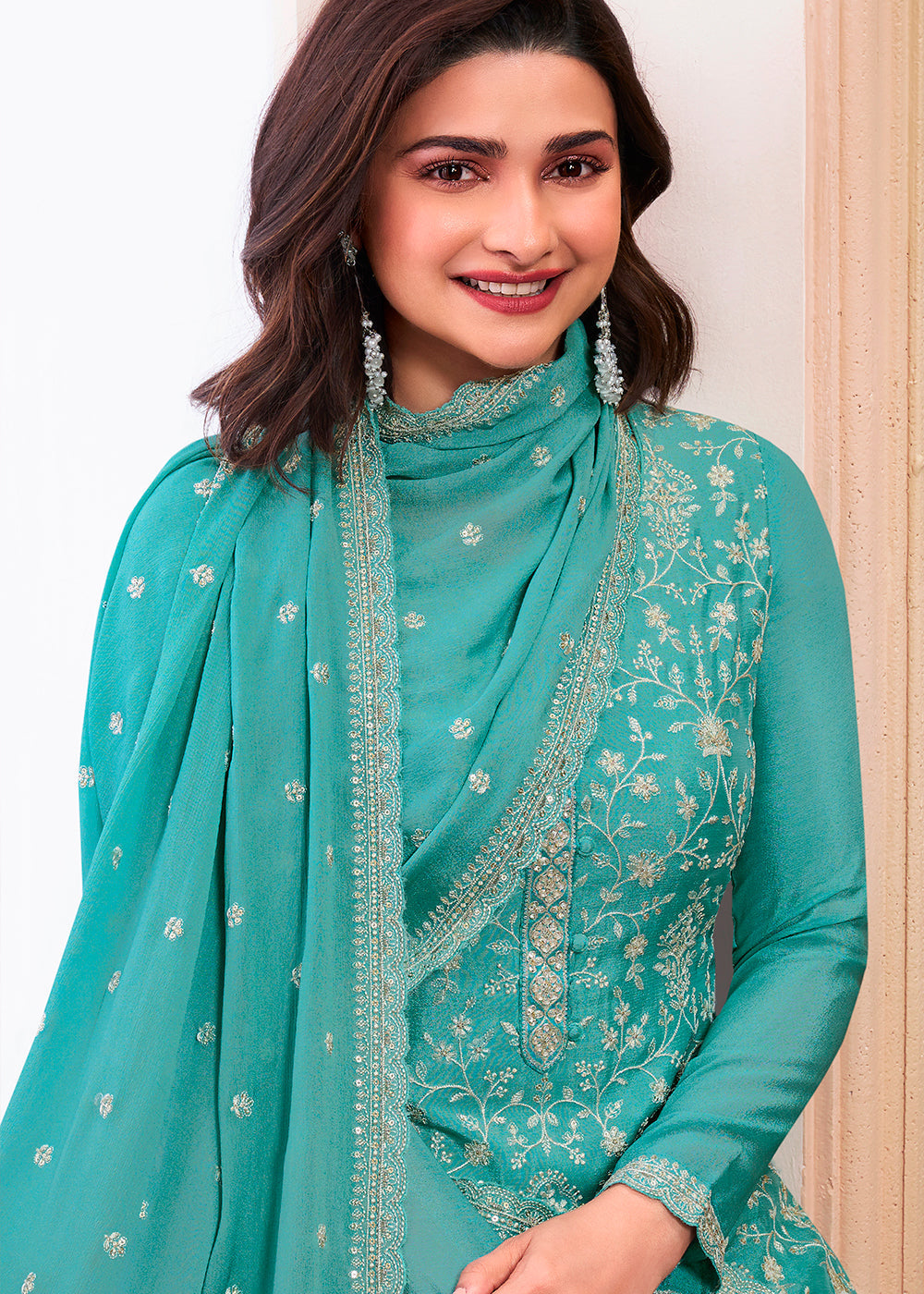 Turquoise blue designer thread embroidered Chinon silk suit with intricate floral patterns