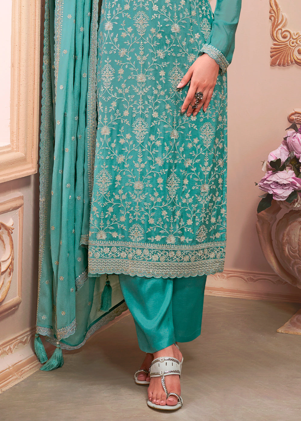 Beautiful turquoise blue designer thread embroidered Chinon silk suit with intricate detailing