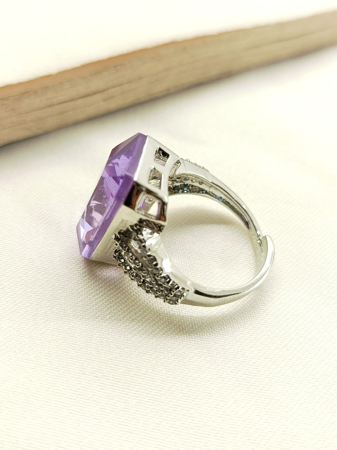  Elegant Samina Lavender American Diamond Finger Ring featuring a stunning lavender-colored stone set in a delicate, silver band