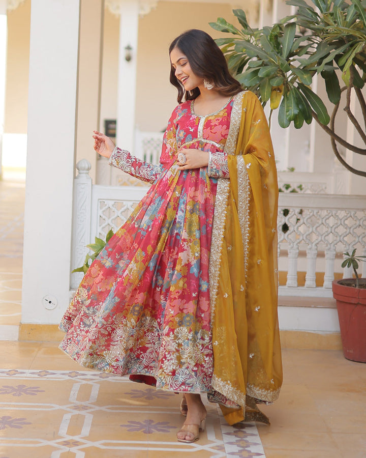 Woman wearing elegant red floral embroidered Alia cut gown with matching dupatta by Qivii for a stunning wedding look