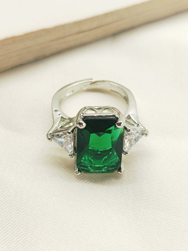 Mehar Green American Diamond Finger Ring, a stunning piece of jewelry featuring a radiant green American diamond set in a sleek and elegant design, perfect for adding a touch of glamour to any outfit