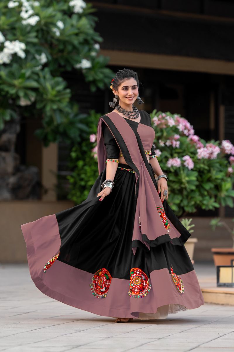 A beautiful dark peach color pure cotton lehenga with intricate Gamthi and mirror work embroidery