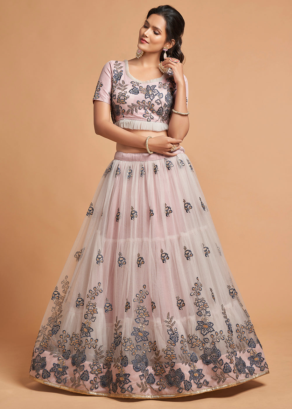 Beautiful pinkish grey designer soft net lehenga choli with intricate thread, dori, zari, and sequins work, a top pick for any special occasion