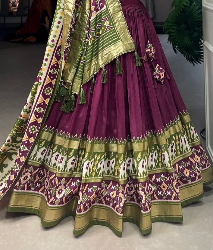 Tussar Silk Patola Print With Foil Work Lehenga Choli In Wine Color