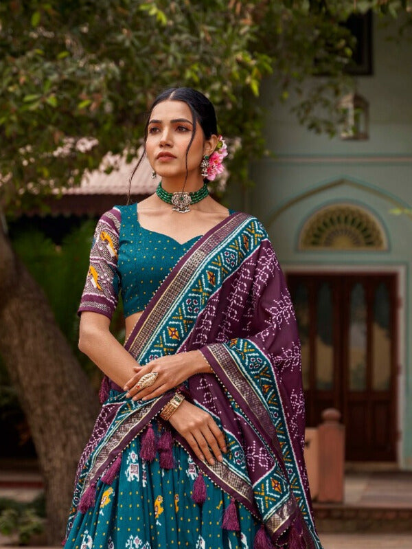 Tussar silk and the mesmerizing allure of ikkat Patola prints lehenga choli in Teal Color