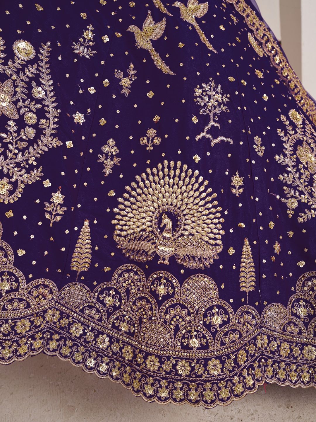Luxurious Purple Lehenga Featuring Intricate Floral and Bird Designs