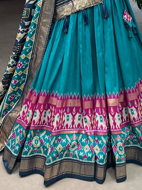 Tussar Silk Patola Print With Foil Work Lehenga Choli In Teal Color