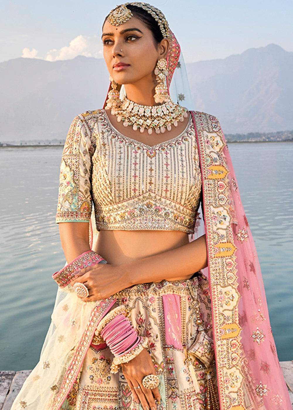 Luxurious cream white lehenga choli featuring heavy embroidery work