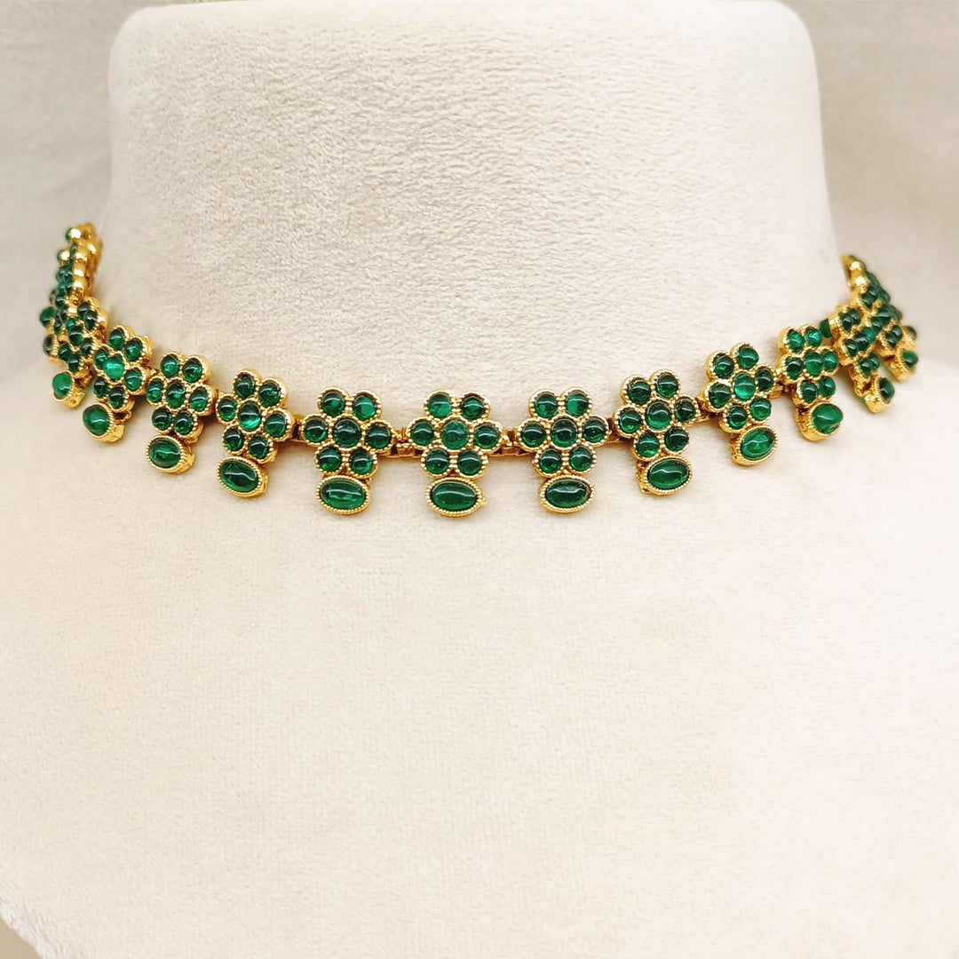 Sai Antique Gold Plated With Green Stones Necklace Set, a captivating and ornate jewelry set with detailed gold plating and shimmering green stones, ideal for adding a touch of luxury to any ensemble