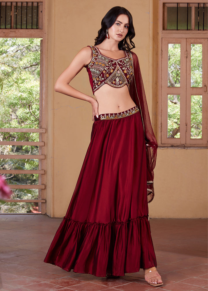 Stunning maroon lehenga choli with intricate gold embroidery and embellishments