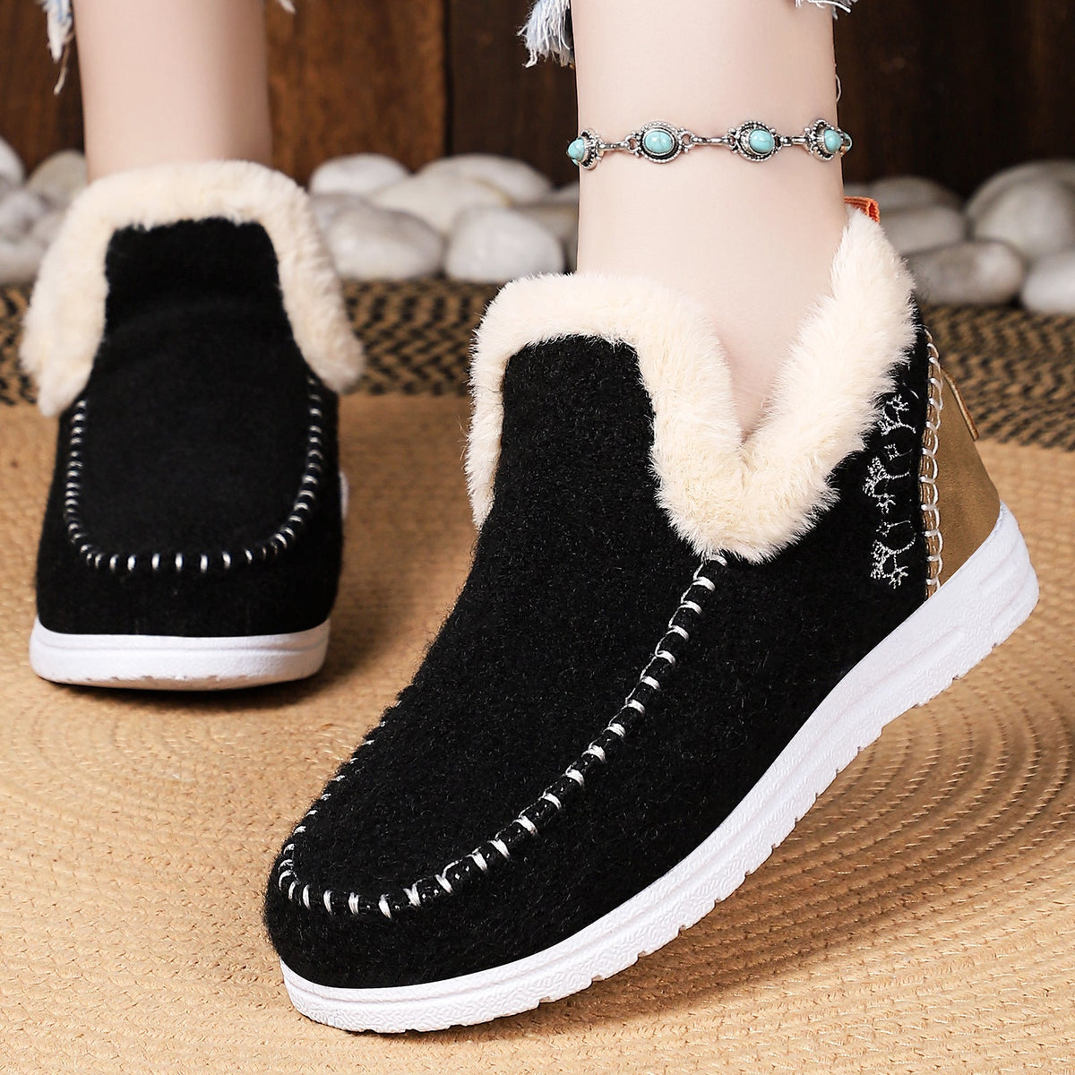 Black women's Wrenvale Faux Fur Lined Winter Shoes by Bootara, round-toe slip-on moccasins for cold weather comfort.