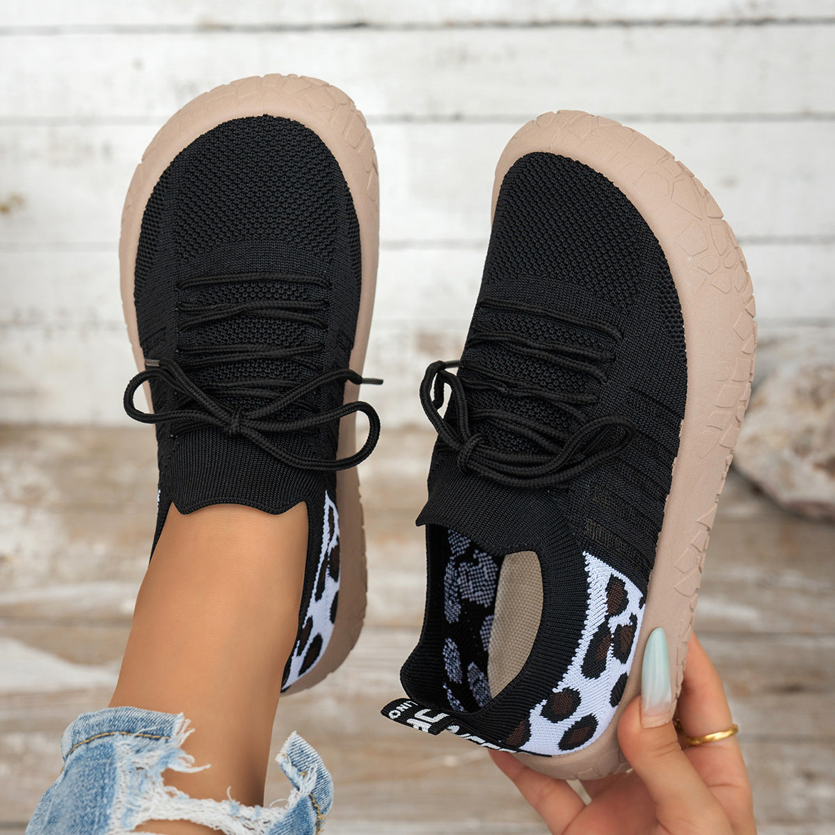Women's Cerynna Knit Sneakers by Bootara with leopard detail, slip-on design, chunky sole, in black, US size 10.