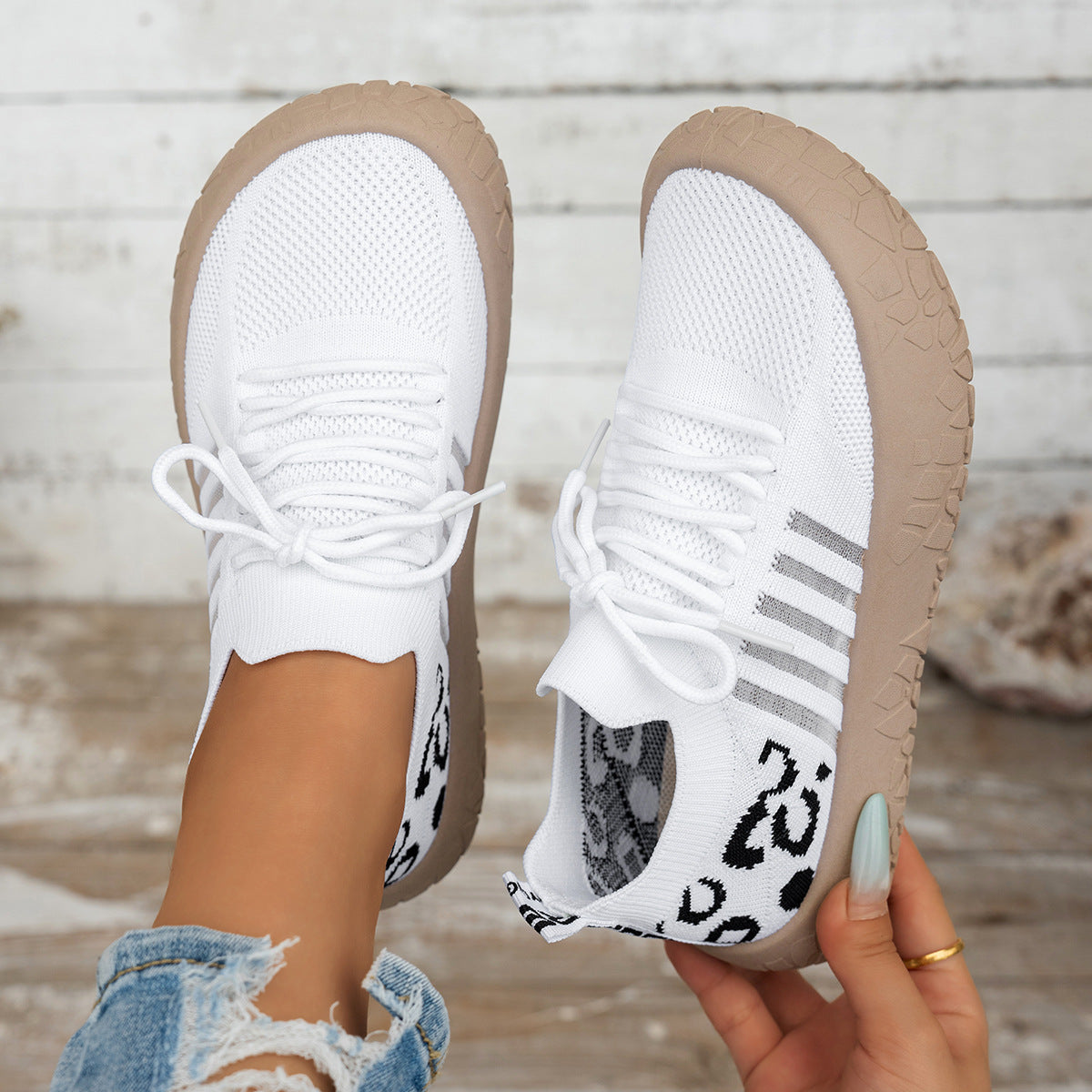 Women's Cerynna Knit Sneakers by Bootara featuring leopard print details, slip-on design, and chunky sole in white.