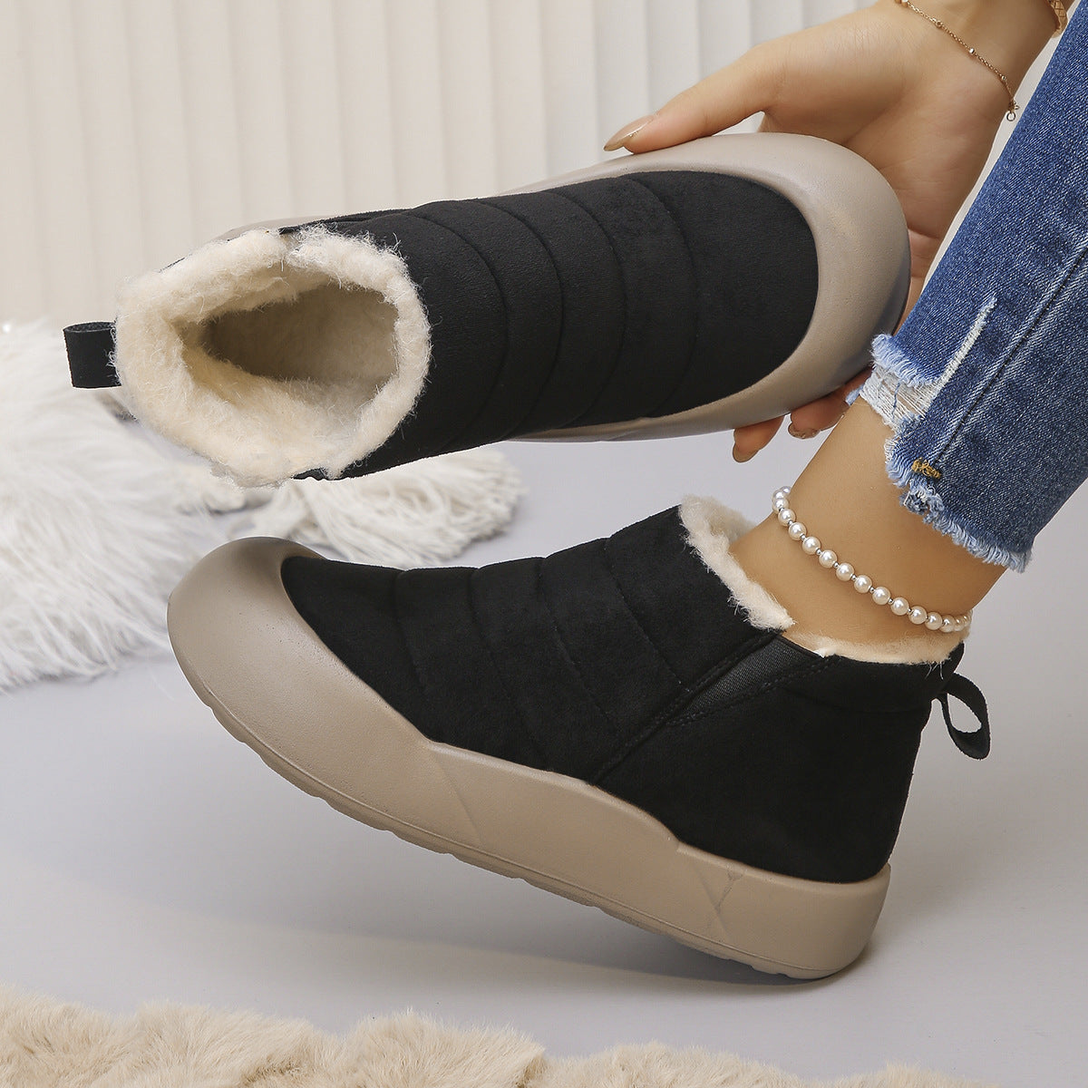 Women's Bootara Sorielle black winter ankle boots with plush lining, quilted detail, slip-on design, and rubber sole in US size 7.