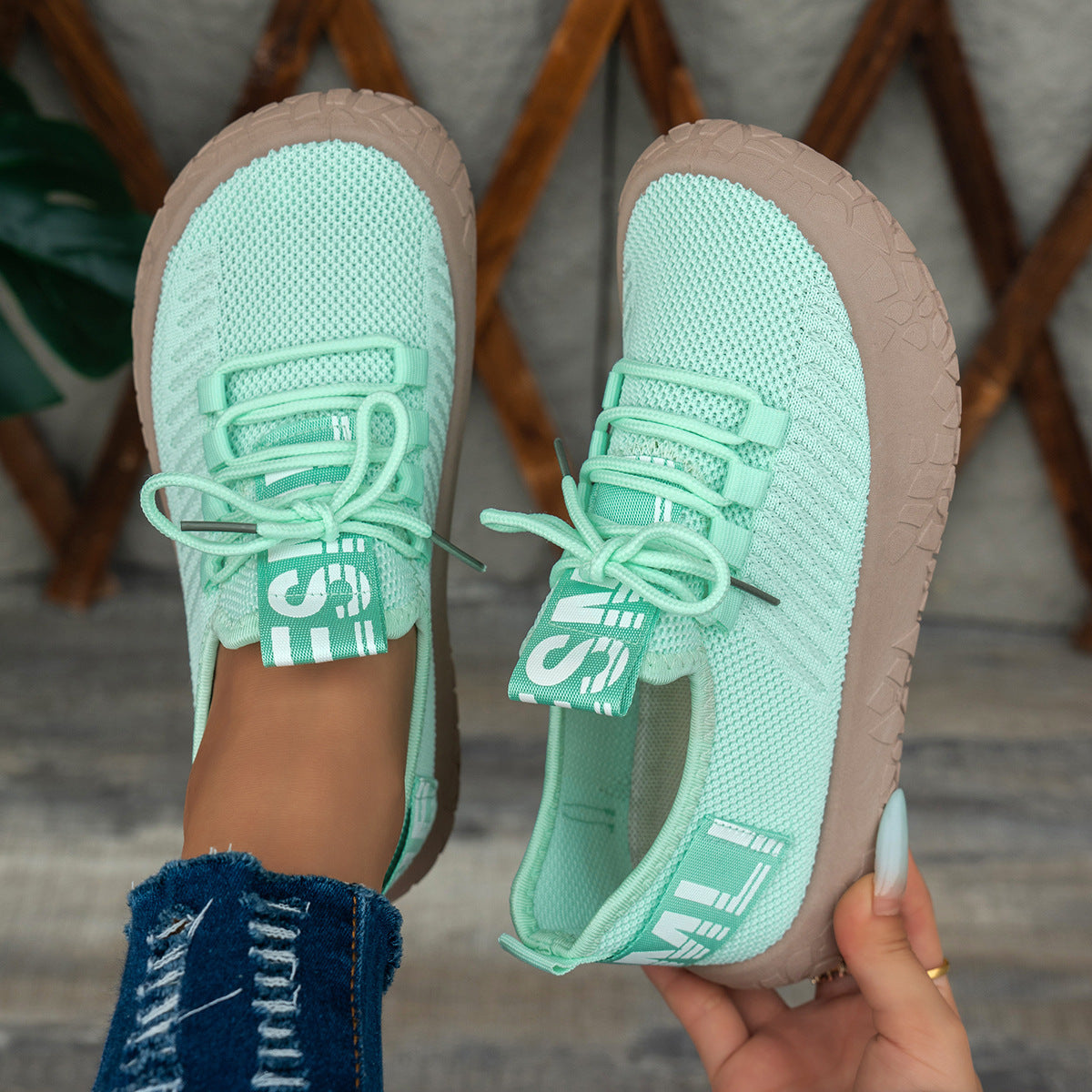 Light green women's Kestielle Knit Sneakers by Bootara with slip-on design, laces, and chunky textured sole, available in US 5-10.5