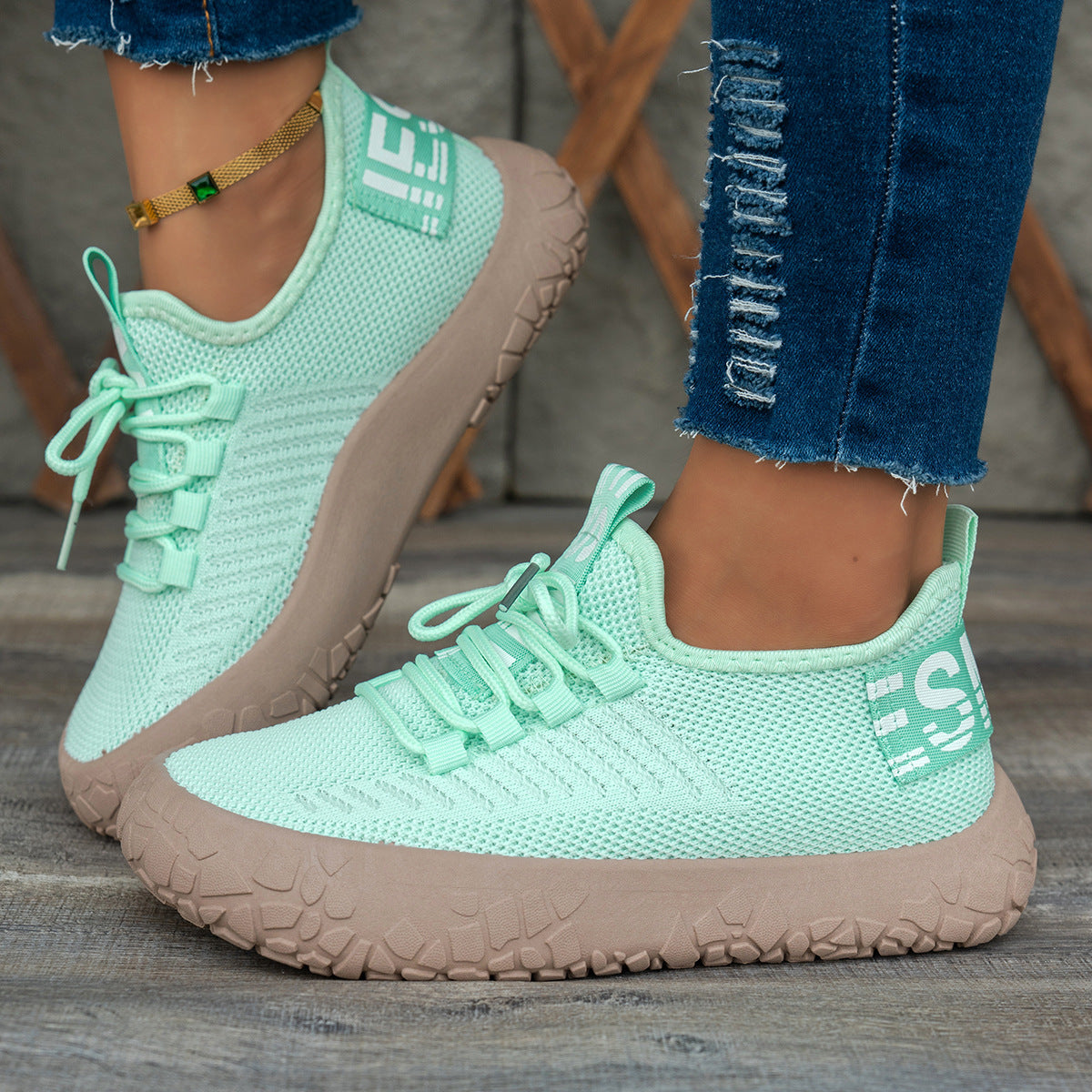 Light green women's Kestielle Knit Sneakers by Bootara with slip-on design, laces, and chunky textured sole, available in US sizes 5-10.5.