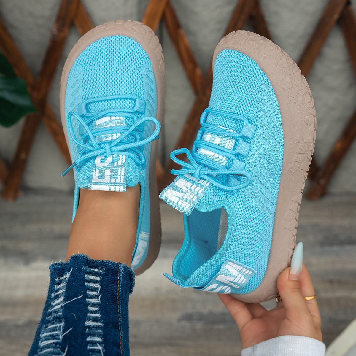 Women's Kestielle Knit Sneakers by Bootara in red with slip-on design, laces, and chunky textured sole, available in US sizes 5-10.5.