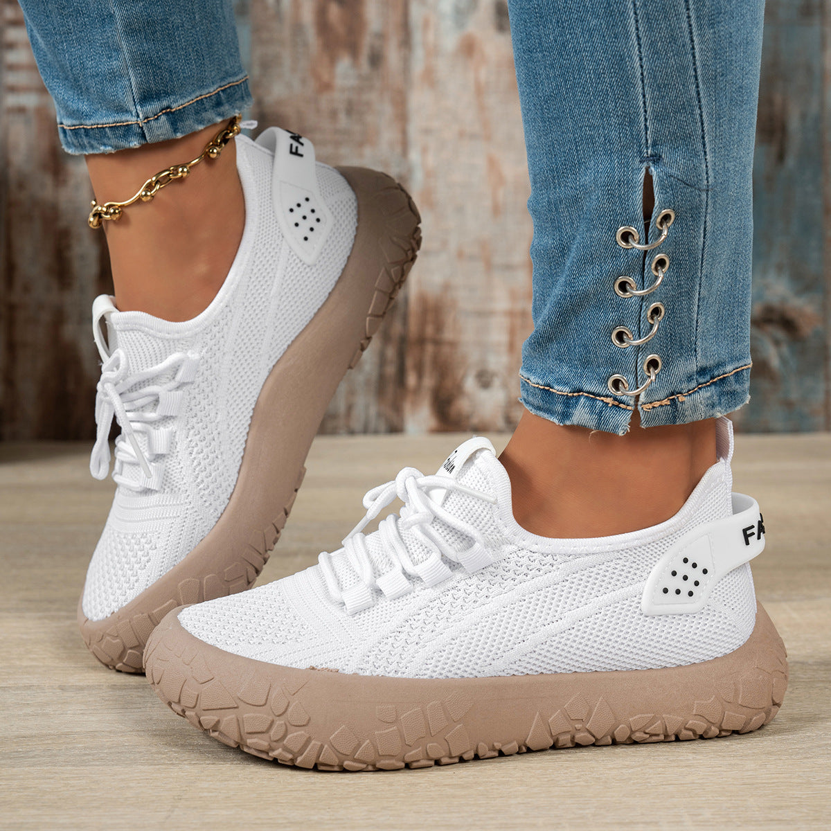 White women's Thessalie Knit sneakers by Bootara featuring breathable slip-on design, laces, and textured chunky sole.
