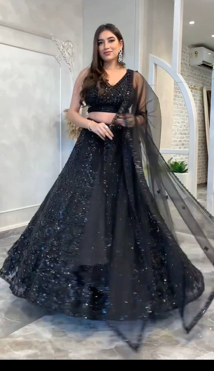 Black net lehenga with intricate dori and sequins work, perfect for weddings and special occasions