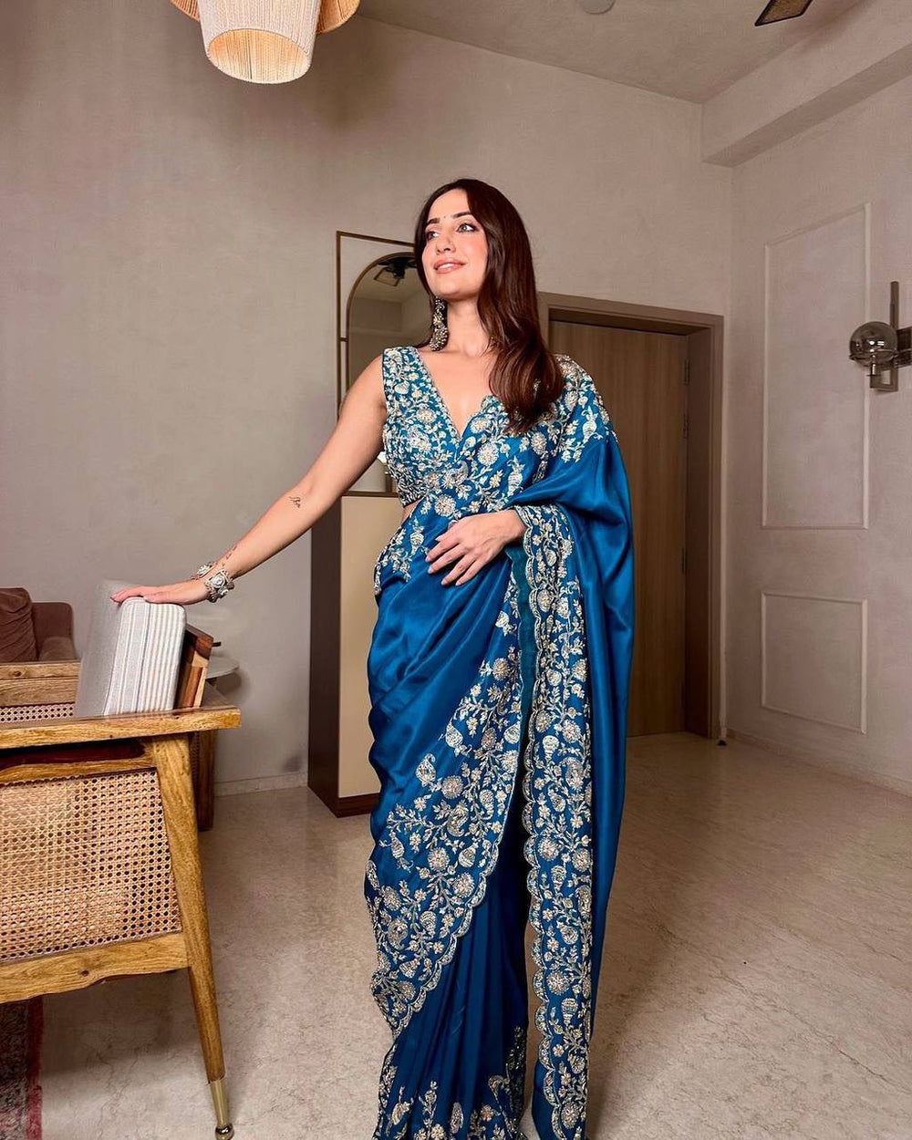 Blue Chinon saree with heavy thread and sequence work, inspired by traditional designs and perfect for special occasions