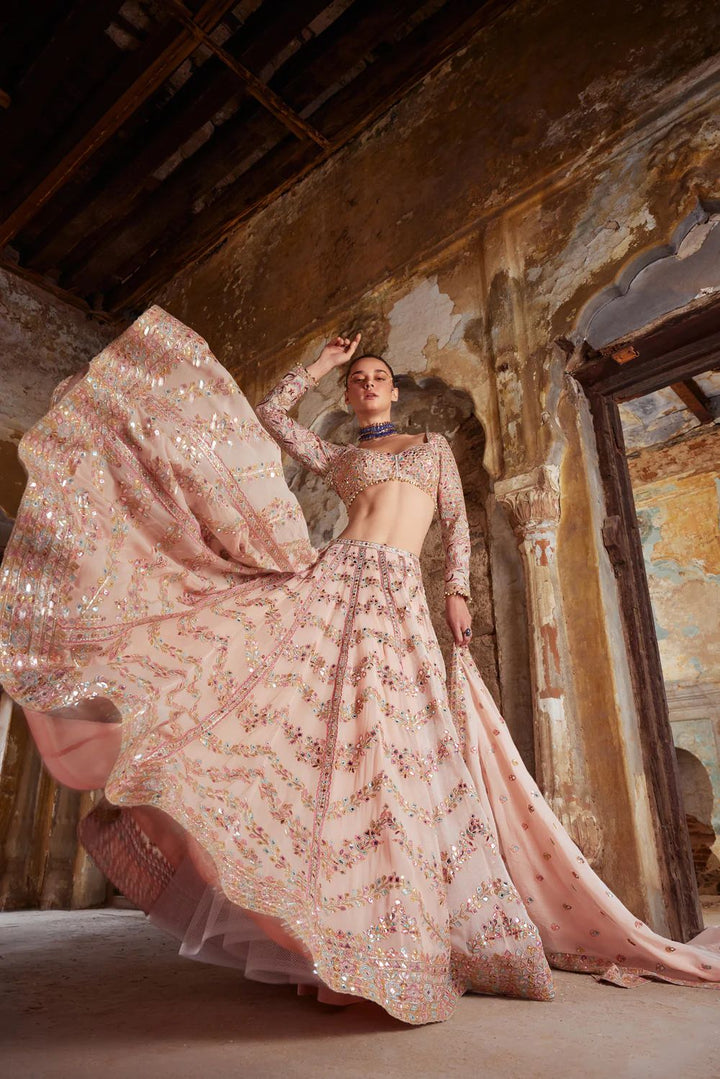  Elegant pink georgette lehenga featuring detailed thread work and paper mirror embellishments