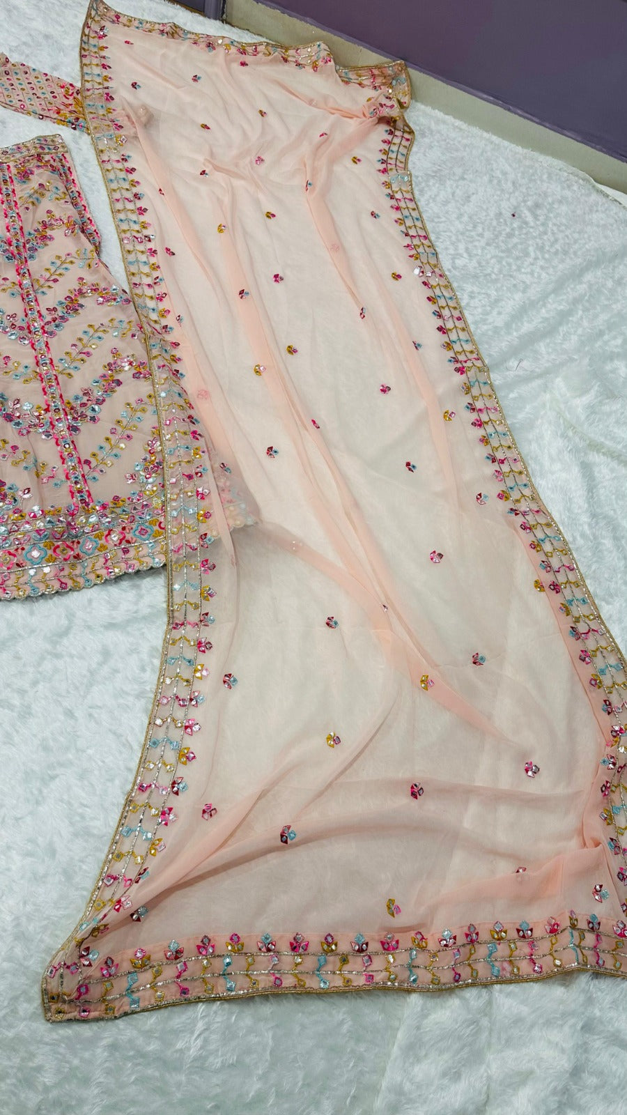  Beautiful faux georgette lehenga in pink color with stunning paper mirror and zari work