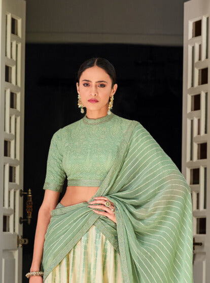  Gorgeous Gaji silk lehenga featuring intricate digital printing in white and green, complemented by a stunning Chikankari work blouse