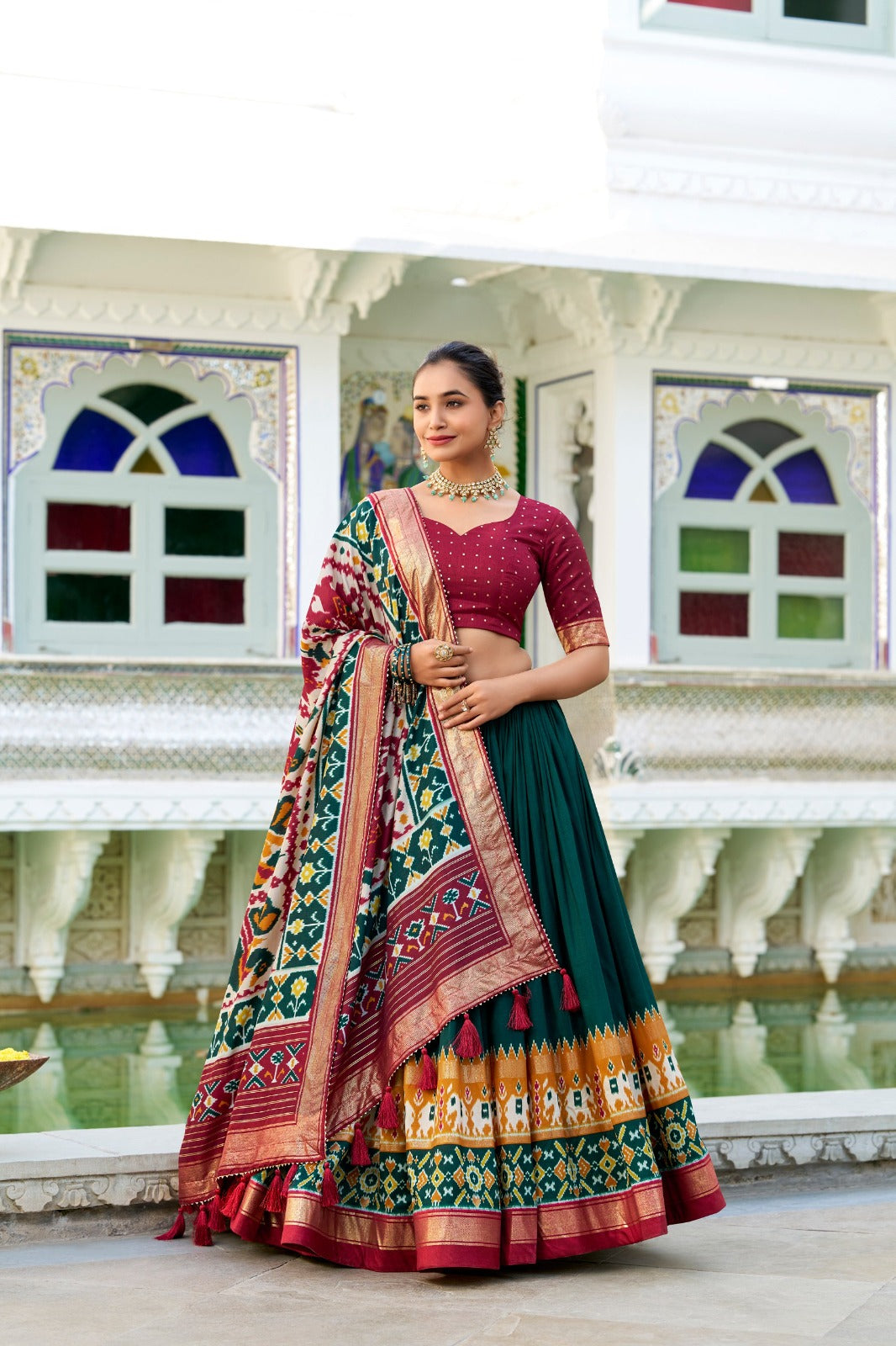 Green Tussar Silk Patola Print With foil work Lehenga, a traditional Indian outfit with intricate handcrafted designs and vibrant colors, perfect for special occasions and celebrations