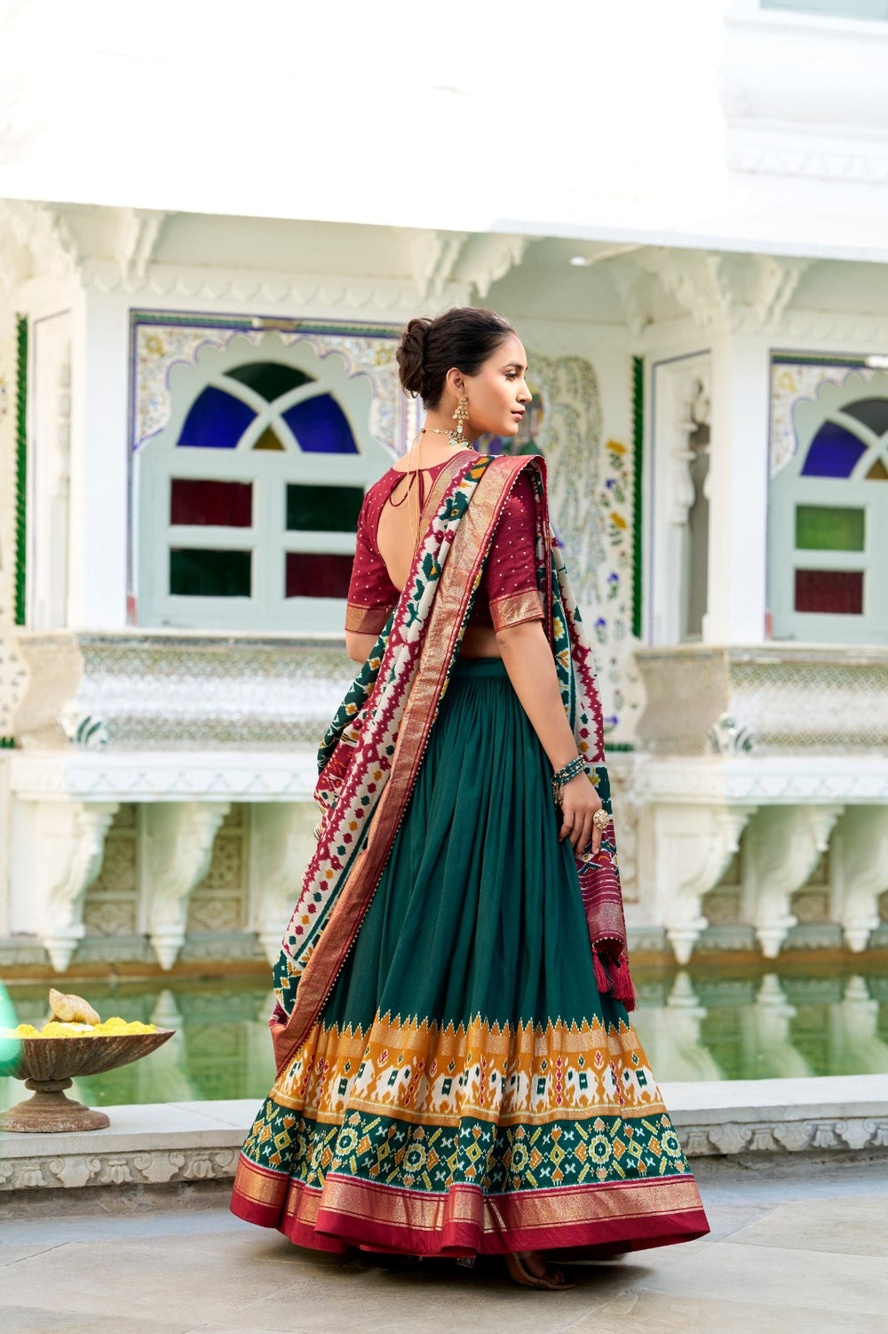 Elegant Green Tussar Silk Patola Print With foil work Lehenga, a stunning piece with rich cultural heritage, exquisite craftsmanship, and luxurious fabric, ideal for weddings and festivities