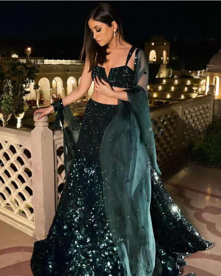 Green Georgette lehenga featuring intricate sequins work for a stunning look