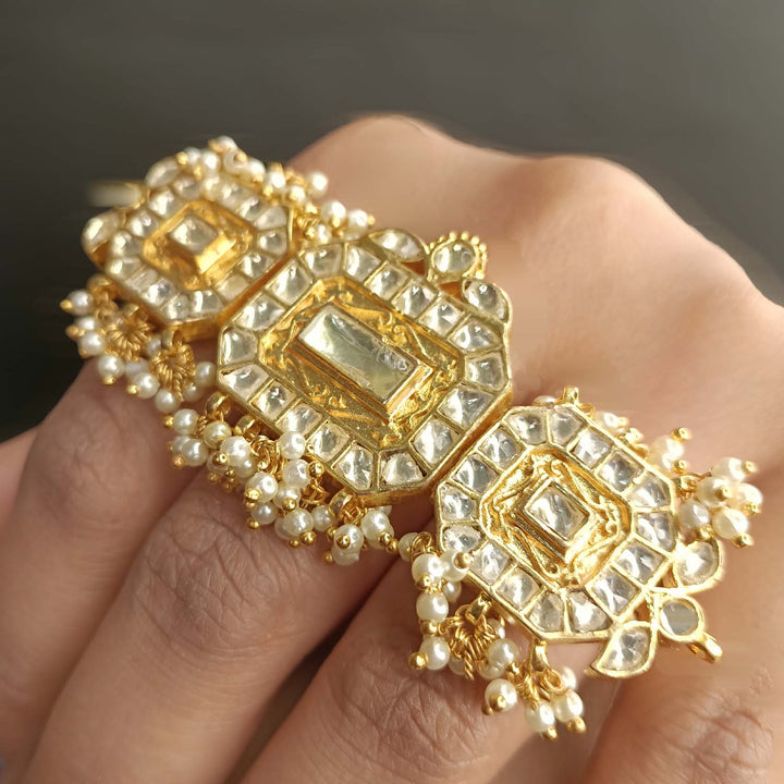 Gold plated three band kundan ring with intricate design and detailing