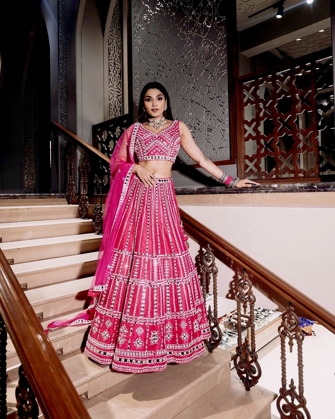 Full-length pink color heavy slub silk lehenga with intricate thread and paper mirror work, perfect for weddings and special occasions