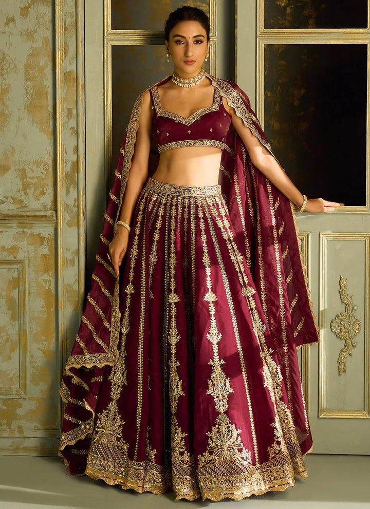 Wine Kasturi silk lehenga with sequins , dori & zari work