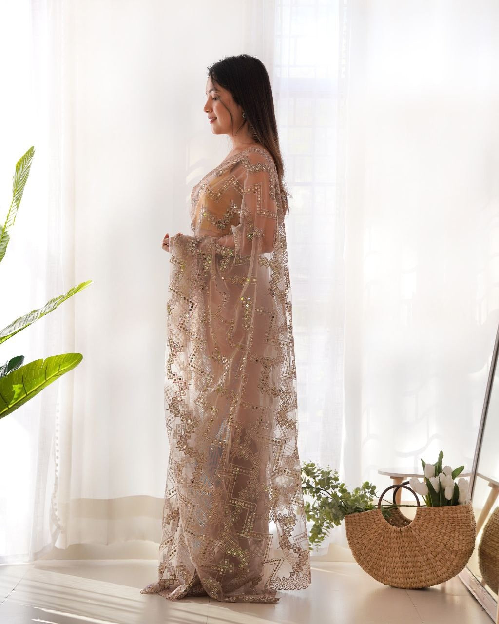 Beautiful heavy butterfly net saree in ivory color with intricate embroidered work