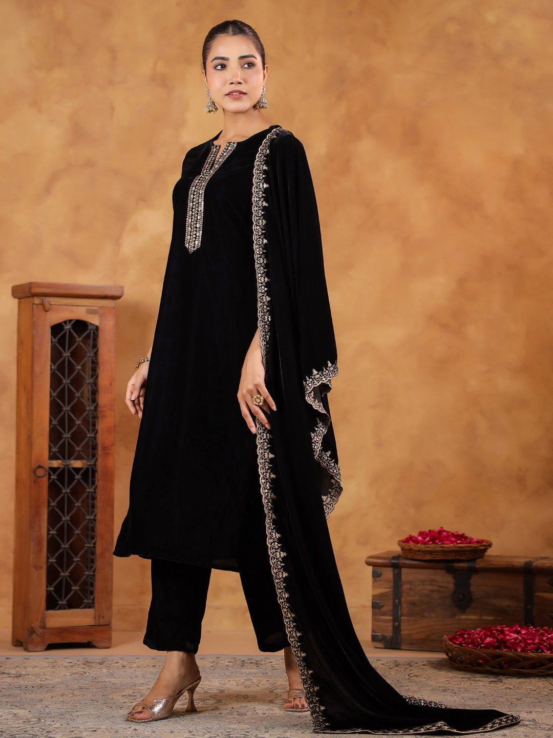 Stylish and sophisticated black velvet kurta set with intricate zari detailing